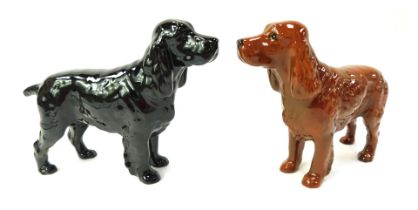 A Beswick pottery figure modelled as a Setter, 14cm high, and another. (2)