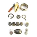 Curios and trinkets, comprising five silver thimbles, silver napkin ring, amber glass cheroot holder