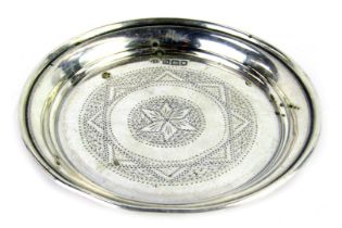 An Edward VII silver pin dish, with star bright central detail, maker JE, London 1908, 1.15oz.