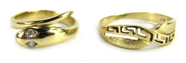 Two dress rings, comprising a snake dress ring set with two tiny diamonds as eyes, size J 1/2, stamp