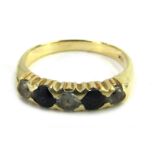 A half hoop dress ring, set with imitation diamond and sapphires, in a claw yellow metal setting, st