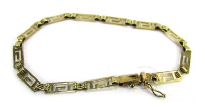 An Eastern inspired bracelet, of Greek key design, yellow metal stamped 585, 18cm long, 4g all in.