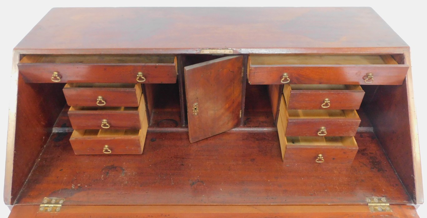 A George III mahogany bureau, the top with a fall, enclosing an arrangement of drawers, recesses and - Image 5 of 5