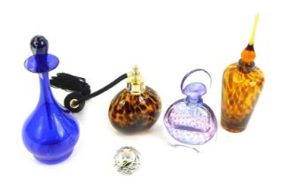 A group of coloured glass ware, comprising a Swarovski crystal paperweight, an Alex Jackson 267B pur