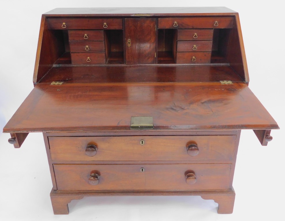 A George III mahogany bureau, the top with a fall, enclosing an arrangement of drawers, recesses and - Image 4 of 5