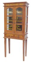 A 20thC oak cabinet on stand, the moulded top above writing for The Notting Hill Bookshop, with two