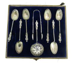 A set of six Victorian silver apostle coffee spoons, with fluted bowls, together with a pair of suga