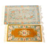 Two Chinese wool cut rugs, in turquoise, 160cm x 92cm, and mustard yellow 69cm x 138cm.
