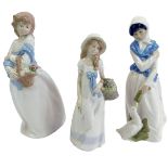 Three Spanish porcelain figures, comprising a Diana figure of a lady carrying a basket of flowers, 3