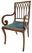 An Edwardian mahogany and inlaid armchair, the pierced back multiple arch form with scrolling arms,