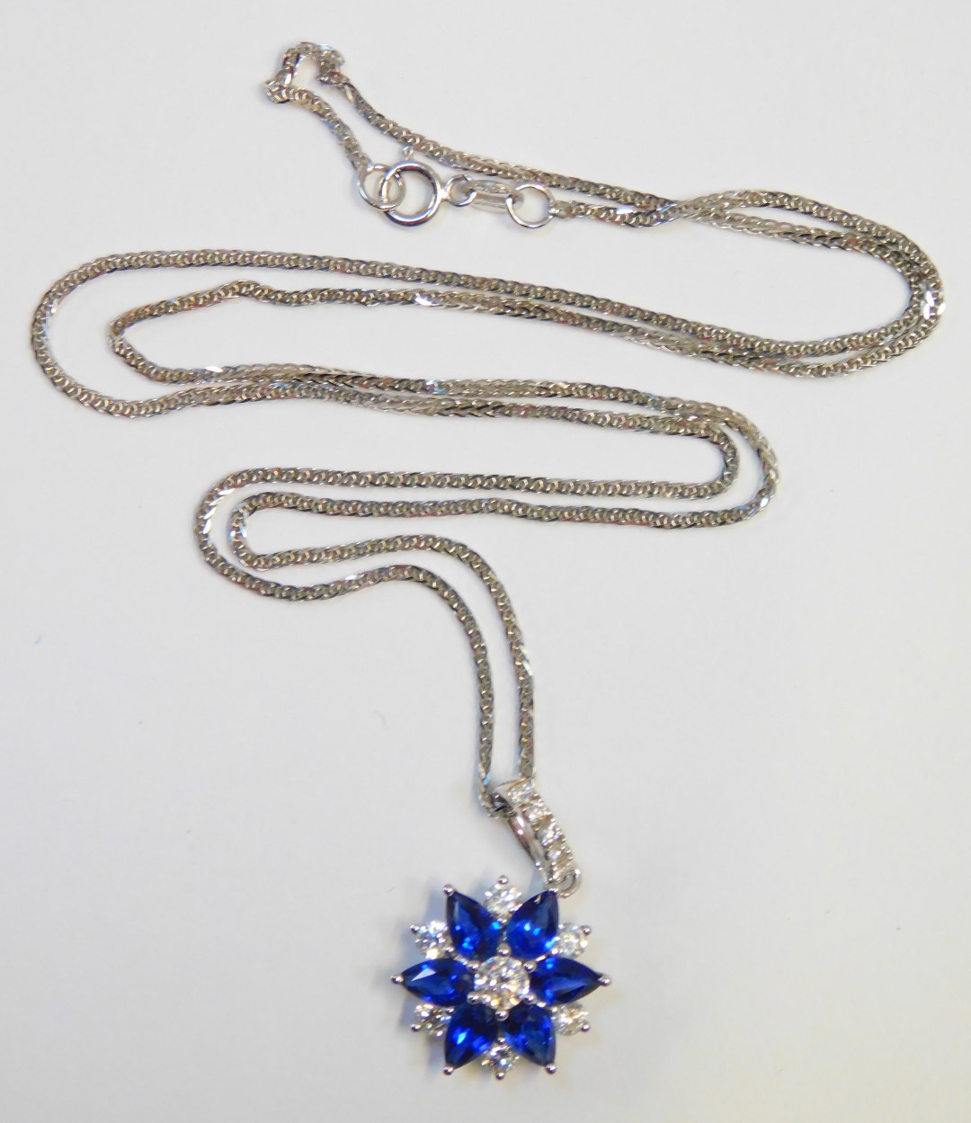 An 18ct white gold, sapphire and diamond pendant and chain, the star design pendant, with three marq - Image 2 of 4