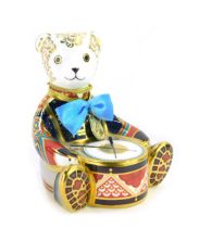 A Royal Crown Derby porcelain Drummer Bear paperweight, gold stopper and red printed marks, 11cm hig