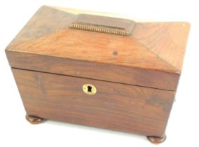 A Regency rosewood sarcophagus shaped tea caddy, the hinged lid enclosing two lidded compartments, o