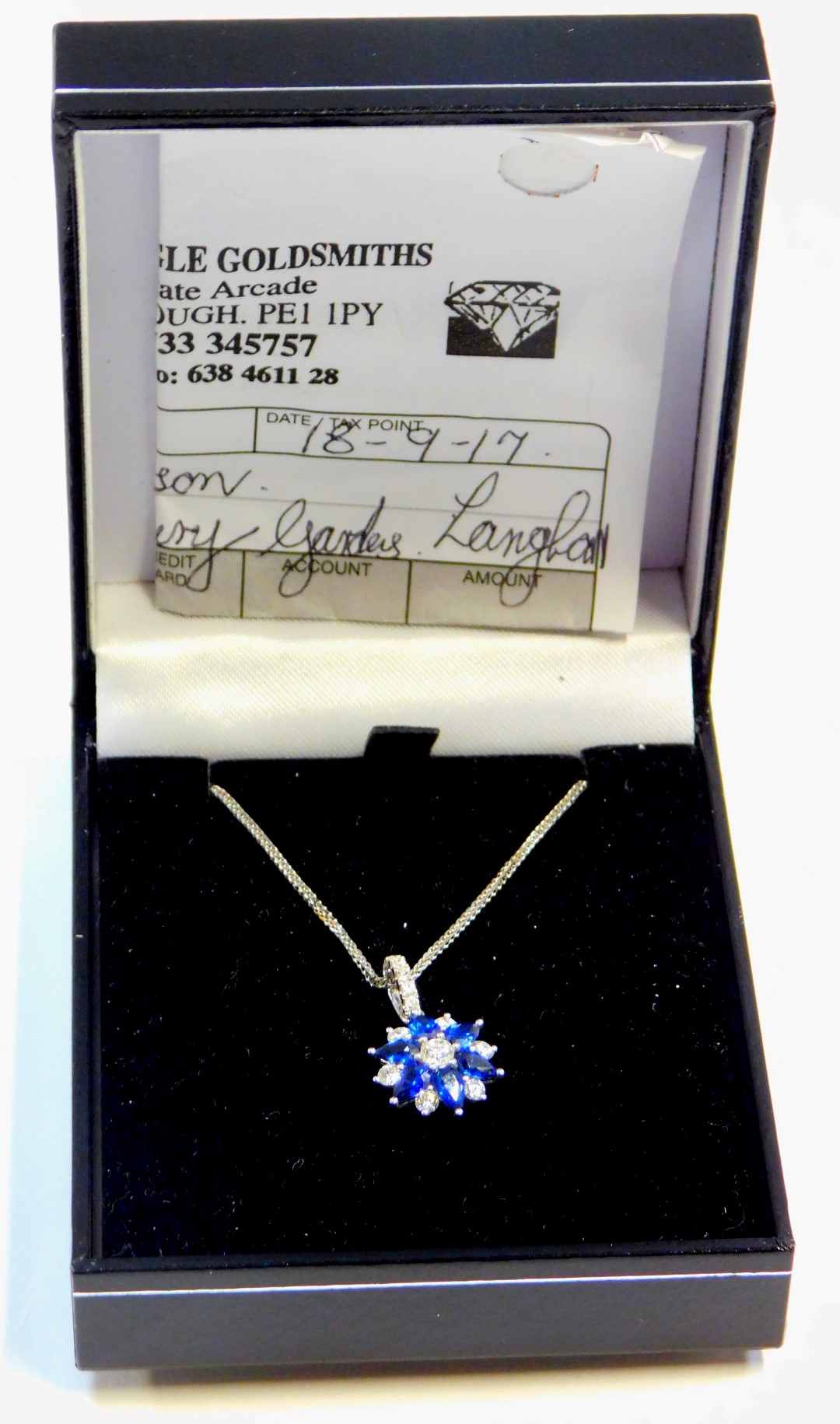 An 18ct white gold, sapphire and diamond pendant and chain, the star design pendant, with three marq - Image 3 of 4