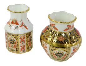 Two Royal Crown Derby porcelain vases, decorated in the Old Imari pattern 1128, comprising Primrose