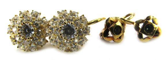 Two pairs of hoop earrings, comprising a pair of 9ct gold floral clusters, each stone set, yellow me