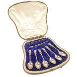 A set of Edward VII silver teaspoons and tongs, each with vacant crest and lion top, maker JR, Sheff