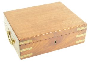 A Victorian mahogany writing box, with brass bound corners and two brass handles opening to reveal a