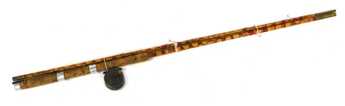 A three piece split cane fishing rod, and a steel fishing reel. (2)
