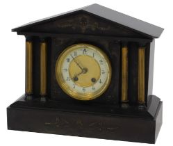 A Victorian black slate mantel clock, with brass dial, with enamel chapter ring bearing Arabic numer