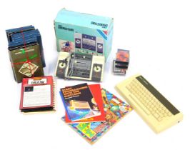 A group of Acorn Soft cassettes, Acorn computer procedure manual, an Amstrad Grandstand and an Amstr