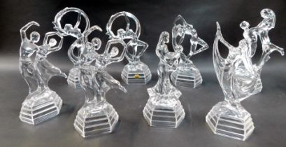 A group of moulded glass figures, modelled as dancers, in various poses, the largest 29cm high. (a q