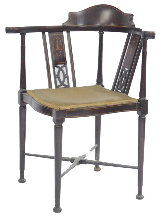 An Edwardian mahogany and inlaid corner chair, with pierced two section back, overstuffed seat, on t