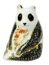 A Royal Crown Derby porcelain paperweight, modelled as a panda, gold stopper and red printed marks,