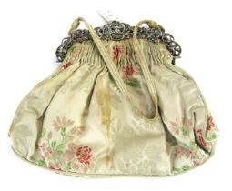A Victorian silver topped evening bag, with floral silk work embroidery, the clasp with pierced and
