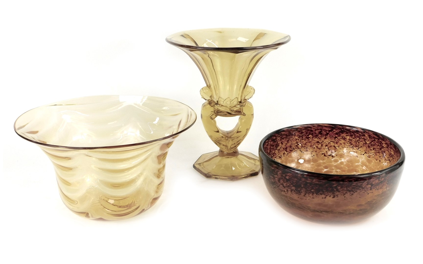 A group of amber tinted glassware, comprising bowl of tapering form, 26.5cm diameter, pedestal dish,