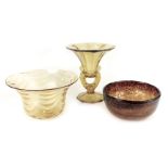 A group of amber tinted glassware, comprising bowl of tapering form, 26.5cm diameter, pedestal dish,