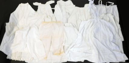 A group of early 20thC and later Christening gowns and child's dresses, some worked, together with a