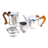A Piquot ware stainless steel four piece tea service, comprising teapot, hot water jug, two handled