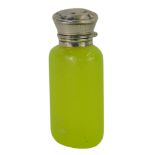 A Victorian yellow glass and silver topped scent bottle, engine turned decoration, bearing rubbed ma