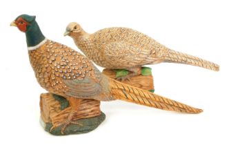 Two Peggy Conner Ceramics cock and hen pheasants, 25cm and 19cm high. (2)