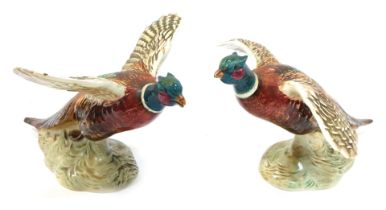 Two Beswick pottery figures modelled as pheasants in flight, 849 and 850, printed and impressed mark