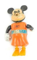 A Walt Disney clockwork Mickey Mouse figure, Produced by Tomy, 16cm high.