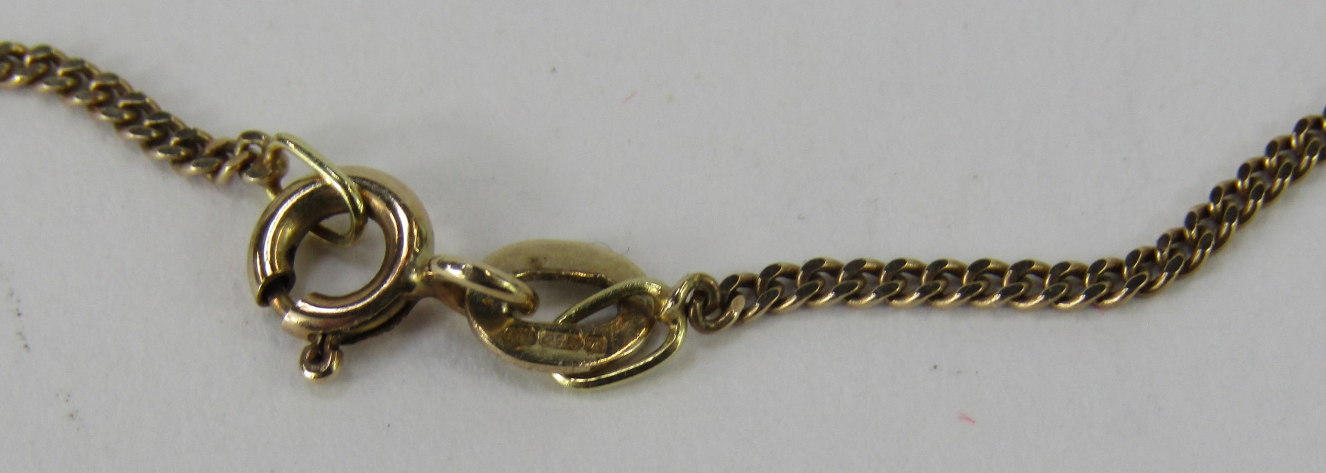 An Elizabeth II 9ct gold pendant and chain, with an oval cut amethyst, in a crown shaped claw settin - Image 3 of 3