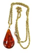 An imitation amber pendant and chain, the teardrop shaped imitation amber droplet, 4cm high, on a fa