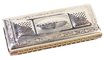 An Alpina German harmonica, boxed.