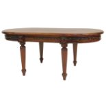 A 20thC mahogany coffee table, the oval top above a flower head and repeat twist pattern edge, on cy