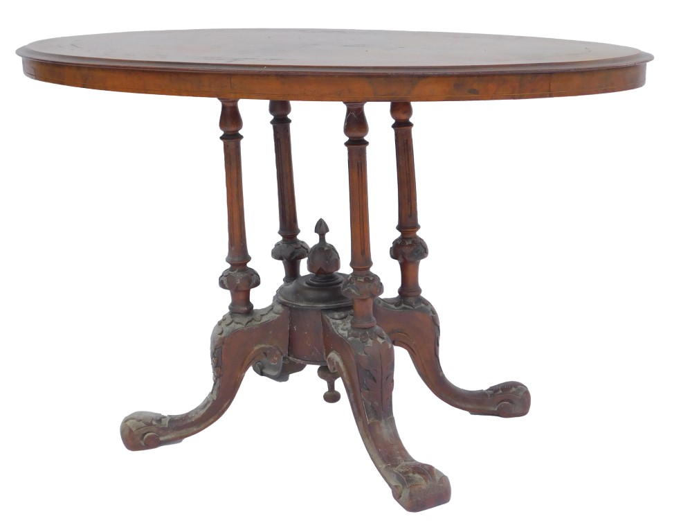 A Victorian walnut and inlaid occasional table, the oval top with floral scroll and line inlay decor
