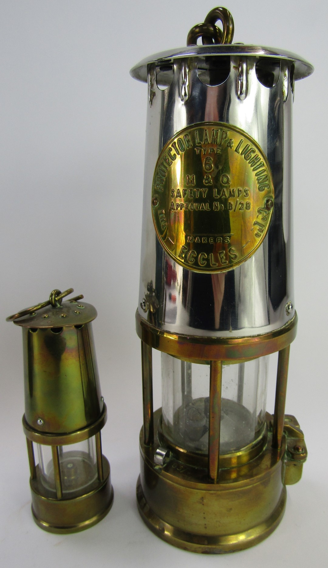 A Protector Lamp and Lighting Company Eccles steel and brass miner's lamp, type 6, 24cm high, togeth - Image 3 of 4