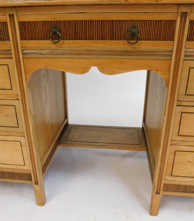 An early 20thC blonde ash pedestal desk by Shoolbred and Co, the top with a moulded edge above centr - Image 4 of 5
