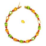 A 9ct gold citrine, peridot and garnet set bracelet, the teardrop cut citrine and peridot links, wit