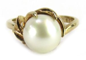 A cultured pearl dress ring, the cream lustre finish cultured pearl in a five point twist design flo