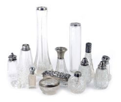 A group of pressed and cut glass silver rimmed jars and pepper pots, the largest 21cm high, the smal