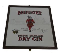 A Beefeater Gin advertising mirror, in wooden frame, 66cm x 50cm.