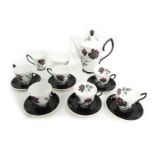 A Royal Albert Masquerade pattern porcelain part coffee service, comprising teapot, milk jug, sugar