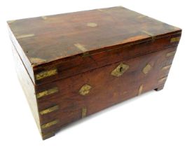 A hardwood and brass bound sewing box, of primitive design, the hinged lid enclosing various recesse